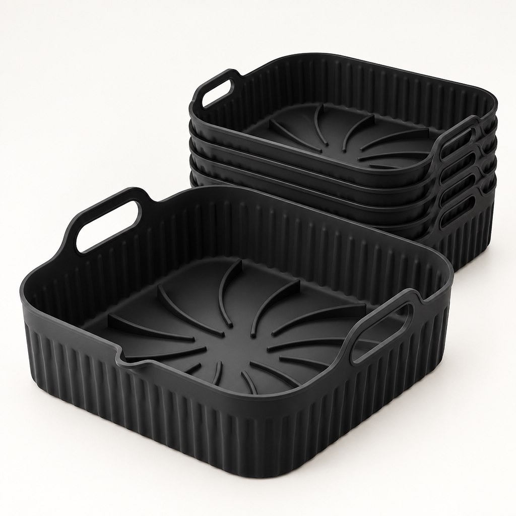 Pack de 6 bandejas de silicona negras Manacor para freidora de aire, de 7,5 por 26 por 24 cm, sobre una superficie clara